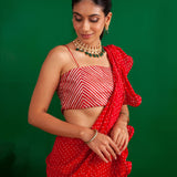 SHAHEEN ABBAS | TOMATO RED BANDHNI DRAPED RARA SAREE, GOTA CROP TOP AND BELT