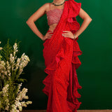 SHAHEEN ABBAS | TOMATO RED BANDHNI DRAPED RARA SAREE, GOTA CROP TOP AND BELT